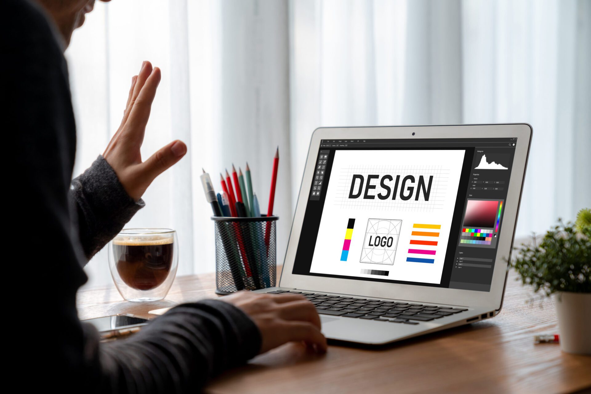 Graphic designer software for modern design of web page and commercial ads showing on the computer screen
